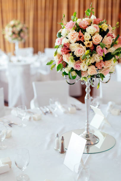 istock Beautiful wedding tables and roses in bouquet 665353522