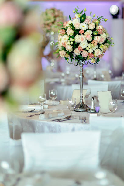 istock Beautiful wedding tables and roses in bouquet 665353636