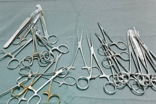 istock Detail shot of steralized surgery instruments with a hand grabbing a tool 665353768
