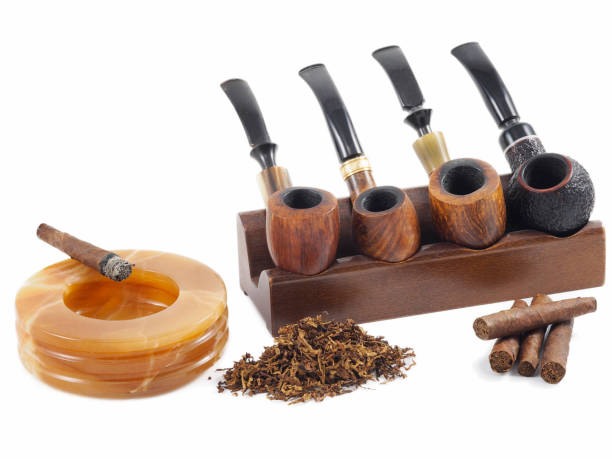 Toscano cigars and smoking pipes. stock photo