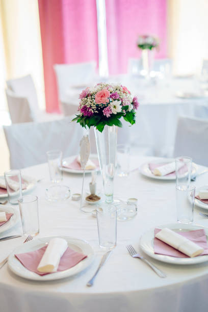 istock Wedding decoration with flowers in vase on a table 665356282