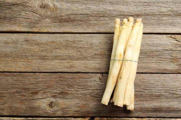 istock Fresh white asparagus on a grey wooden table 665360822