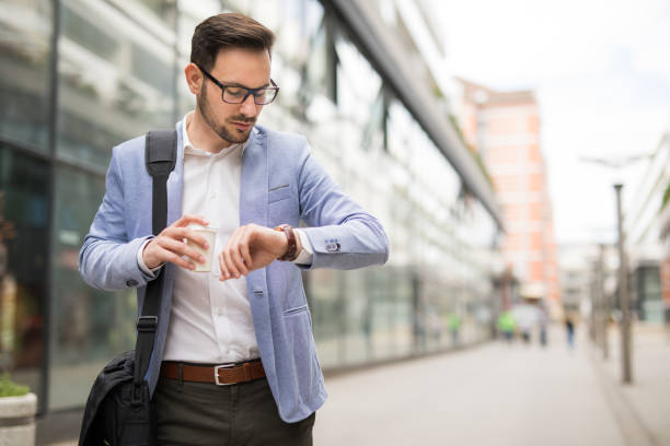 Businessman checking the time on his wrist watch