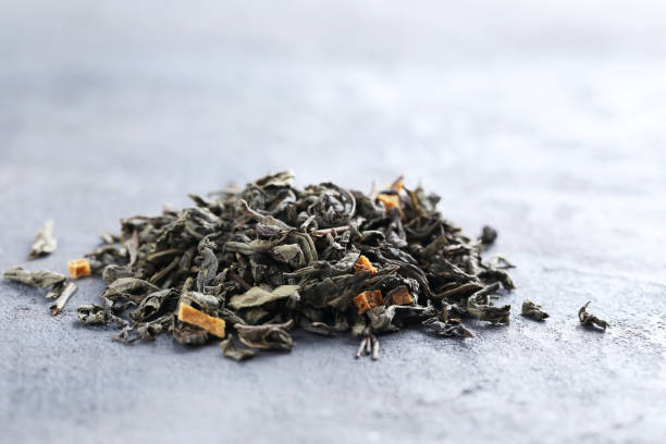 istock Heap of dry tea on grey table 665364018