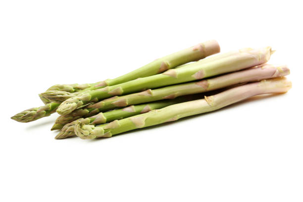 istock Fresh green asparagus isolated on a white 665364040