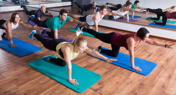 istock People relaxing and enjoying yoga 665364288