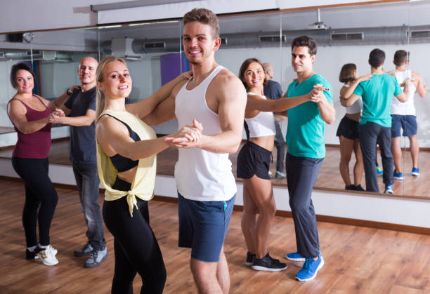 istock girls and men learning salsa 665364356