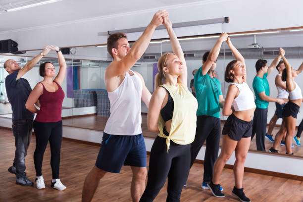 istock Men and women dancing salsa o bachata 665364364