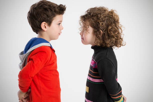 istock boy and girl, portrait in the studio 665364466