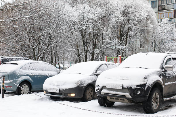 istock car in a winter morning with snow covered 665364596