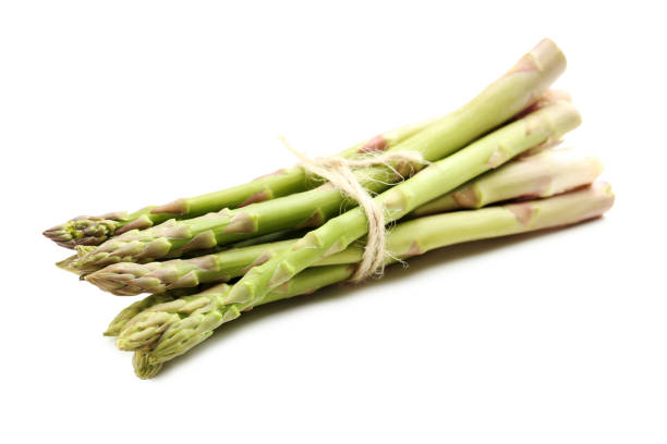 istock Fresh green asparagus isolated on a white 665365816