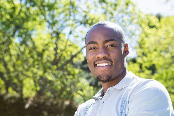 istock Young man standing in garden 665366892