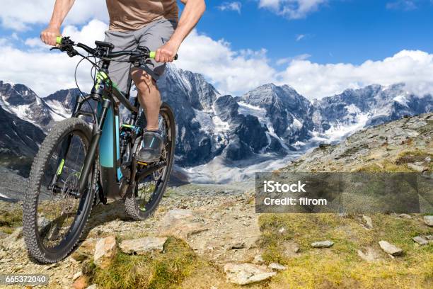 E Bike Rider Mountain Trail Stock Photo - Download Image Now - Electric Bicycle, Mountain Biking, Mountain