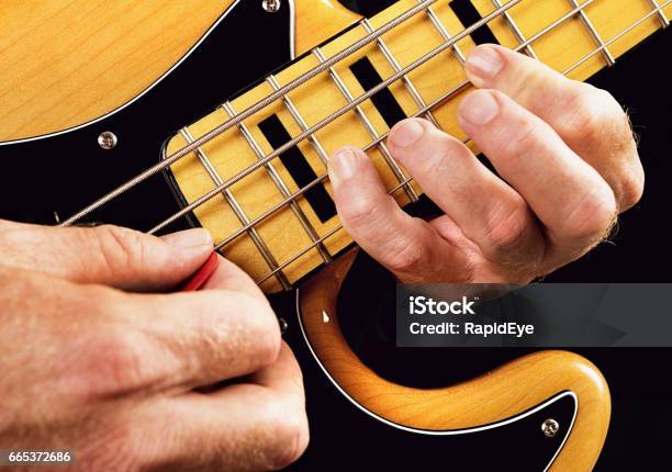 Bass Guitar Tutorial Hands Showing Natural Minor Scale Stock Photo - Download Image Now