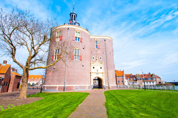 The beautiful historic city of Enkhuizen in North Holland with the unique monument Drommedaris. Drommedaris is a historic gate in Enkhuizen, It was built starting in 1540. The beautiful historic city of Enkhuizen in North Holland with the unique monument Drommedaris. Drommedaris is a historic gate in Enkhuizen, It was built starting in 1540. enkhuizen stock pictures, royalty-free photos & images