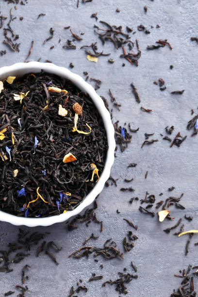 istock Heap of dry tea on grey table 665373024