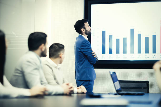 istock Business people analyzing data at meeting in office and doing statistics 665375772