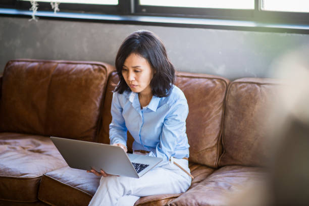 istock Mid adult female designer working in a shared office. 665376054