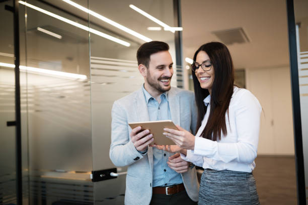 istock Business colleagues talking at workplace modern offices 665376622
