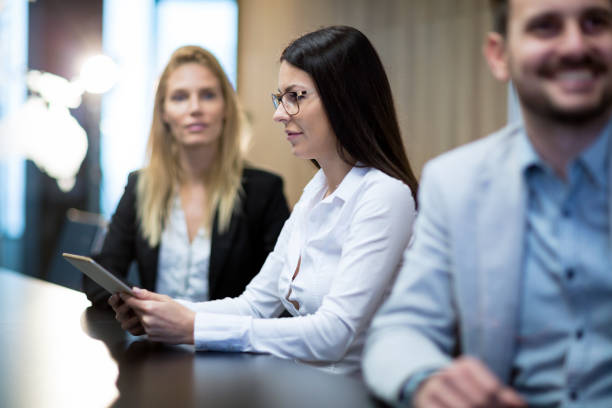 istock Business colleagues in conference meeting room during presentation 665377152