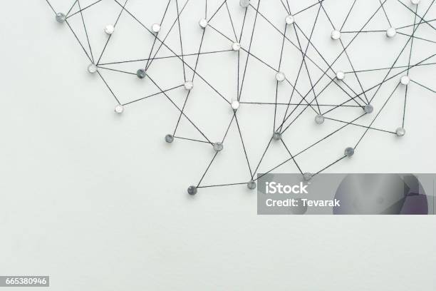 Linking Entities Network Networking Social Media Internet Communication Abstract A Small Network Connected To A Larger Network In Paper Linked Together By Cotton With A Black Tint Stock Photo - Download Image Now