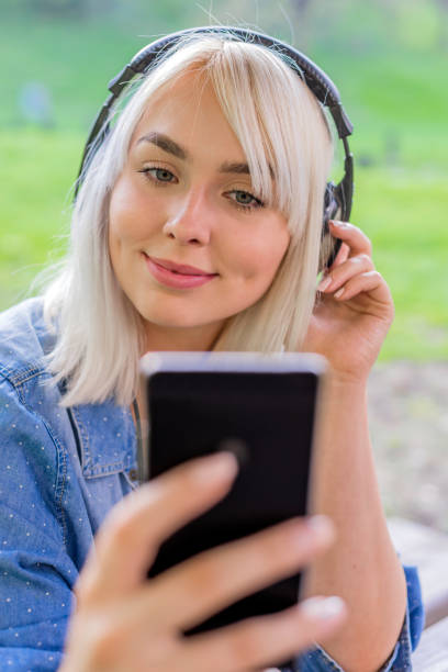 istock Selecting her favourite songs 665389576
