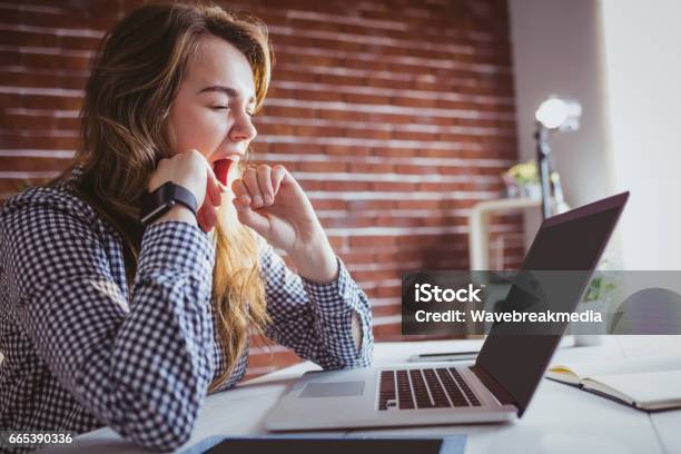 Young Hipster Businesswoman Yawning Stock Photo - Download Image Now - Yawning, One Woman Only, Women