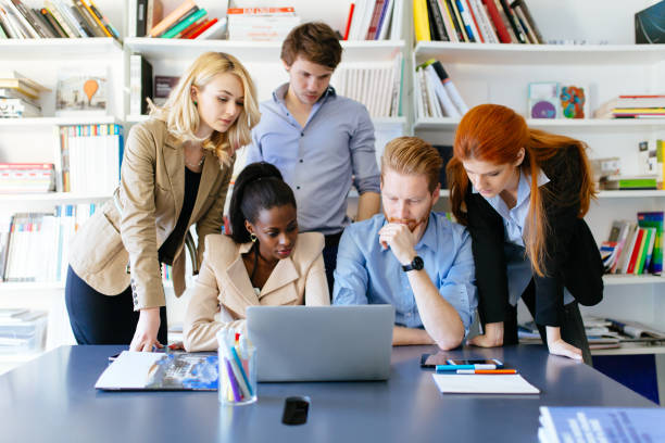 istock Business people collaborating in office and working on project together 665390566