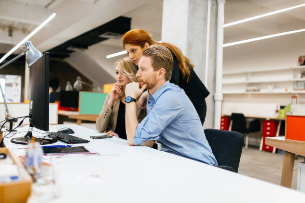 istock Business people collaborating in office and working on project together 665393080