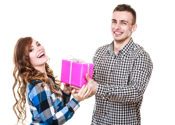 istock couple in love with pink gift box 665394194