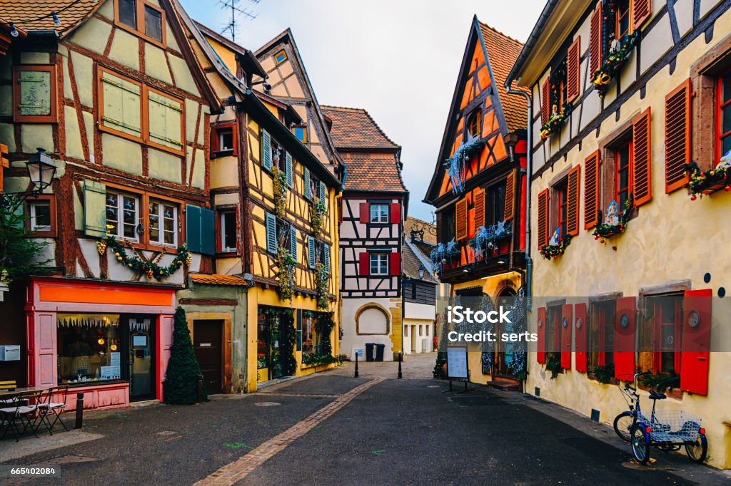 Colorful Houses in Petit Venice, Colmar, France Street view with traditional half timbered colorful houses with noel ornaments of Colmar in the region of Alsace on the French border with Germany. Christmas Stock Photo