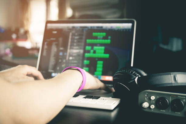10 Ways to Optimize Your Computer for Music Production 7 musician is recording tunes on his computer music