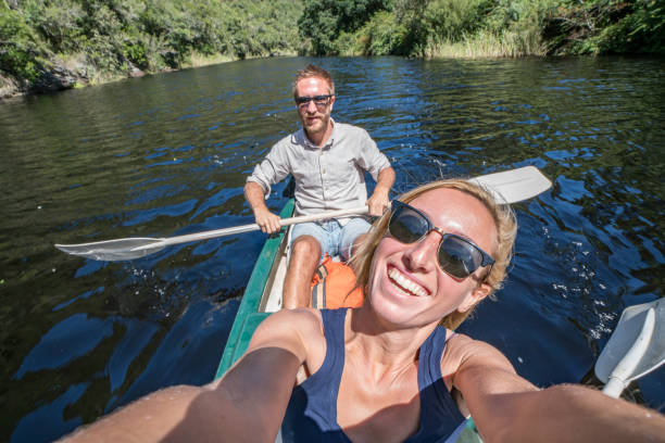 istock Heterosexual couple taking selfie on canoe 665406934