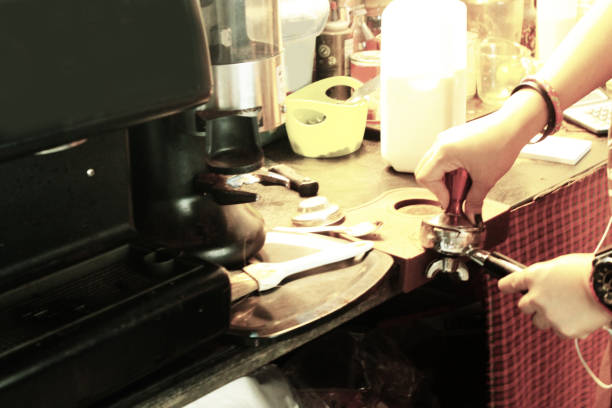 Hand of woman make cup of coffee