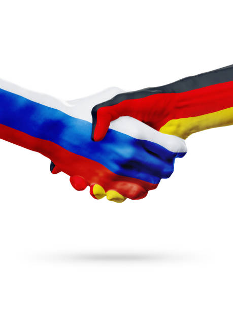 istock Flags Russia, Germany countries, partnership friendship handshake concept. 665411316