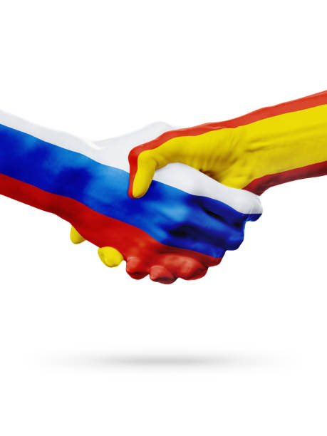 istock Flags Russia, Spain countries, partnership friendship handshake concept. 665411542