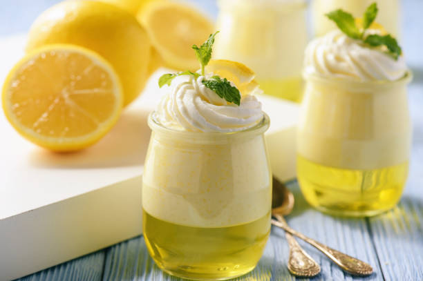 istock Lemon pudding with jelly on wooden background. 665418398