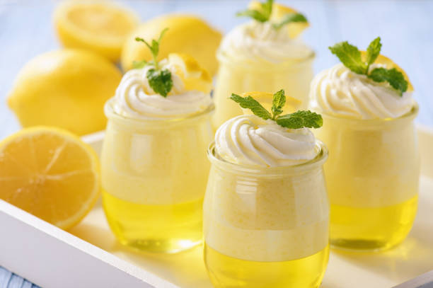 istock Lemon pudding with jelly on wooden background. 665418412