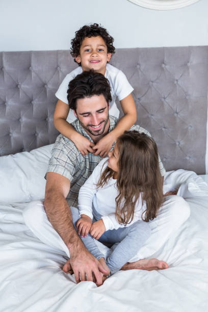 istock Happy family on bed 665424666