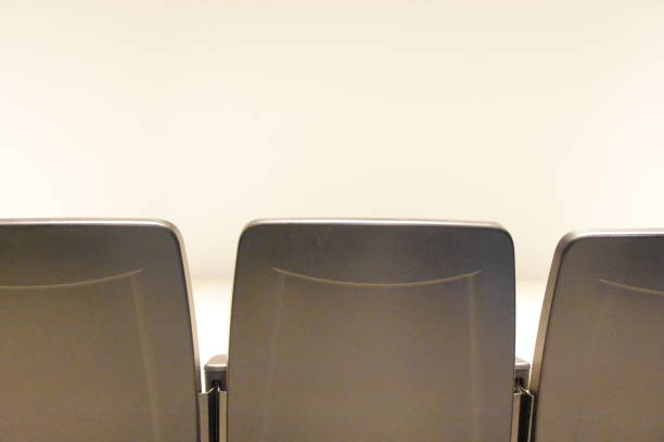 istock Audience chairs in front of a white screen 665427980