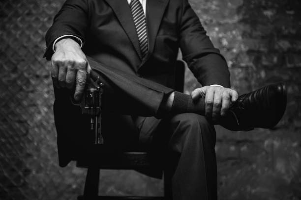 istock Confident crime lord showing who the boss is 665428704