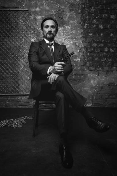 istock Imperious handsome crime leader making death treats 665430700