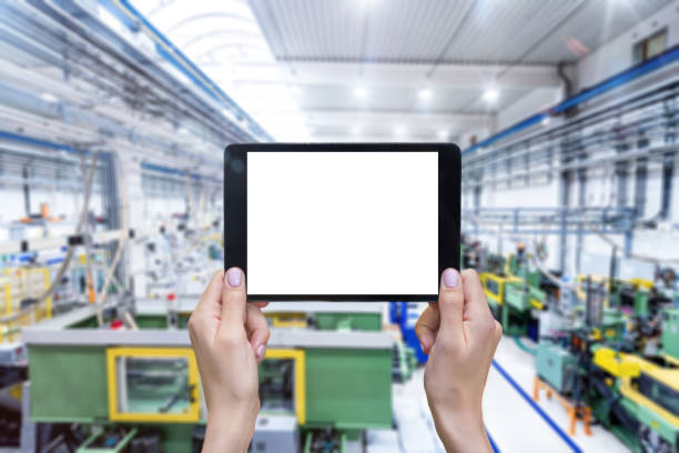 istock Female hands & digital tablet in industrial building 665431514