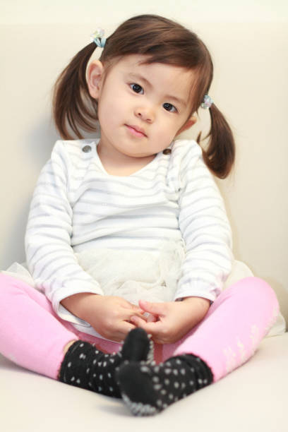 istock Japanese girl sitting on the sofa (2 years old) 665431668