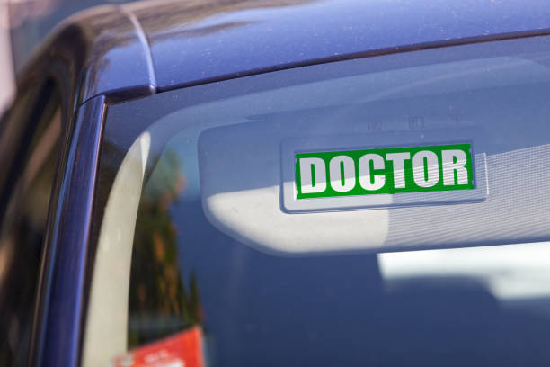istock Doctor - Car sun visor sign 665432458