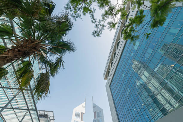 Infinite Corporate Buildings. Business offices skyscrapers on blue sky background. Low angle view of tall corporate buildings. stock photo