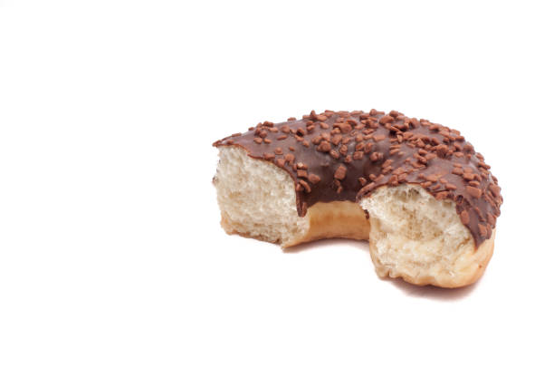 chocolate doughnuts with nuts on white