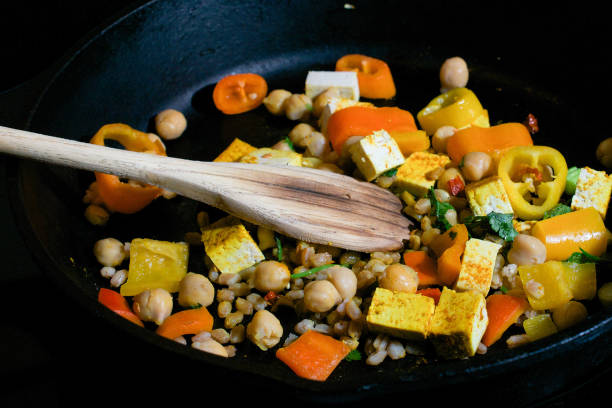 istock Cooking vegetarian meal in iron skillet 665455814