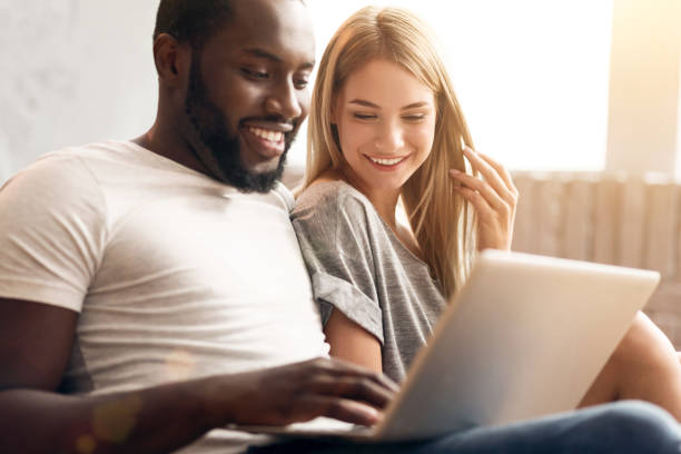 istock Peaceful international couple relaxing at home 665456114