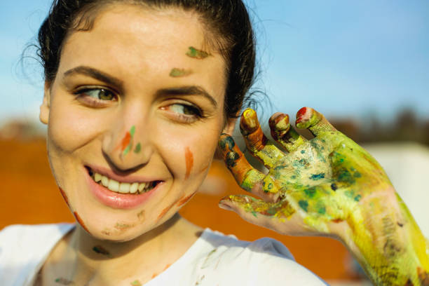 istock Young woman have a fun with colors 665472380